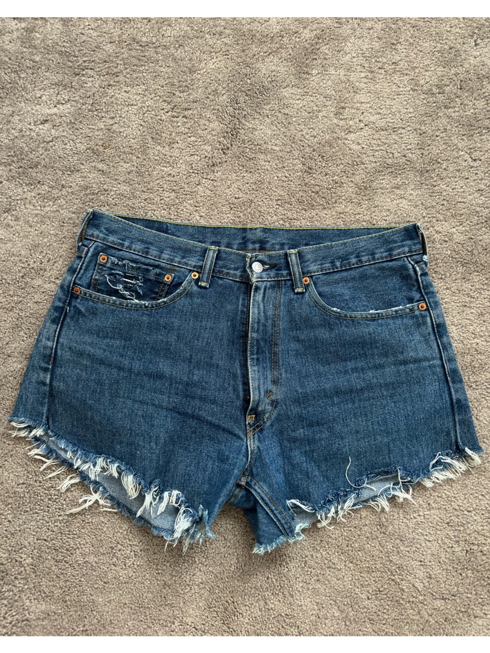Levi's 550 Distressed Cutoffs
Denim Mid Shorts